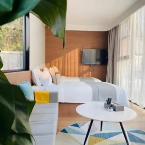 Apple cabin hotel room with twin beds and TV for resort guests