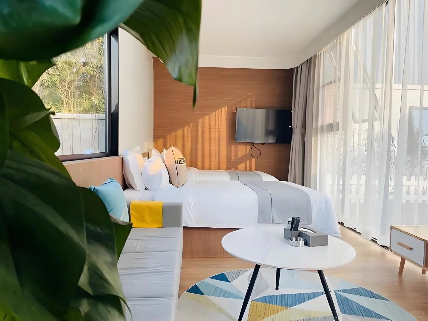 Apple cabin hotel room with twin beds and TV for resort guests