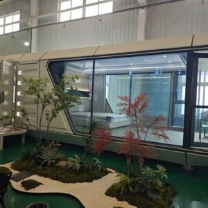 Capsule house balcony terrace with table and chairs overlooking garden
